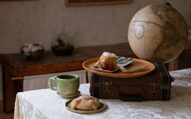 Serene still life of a coffee cup, jar of honey, and lavender flowers on a wooden table.